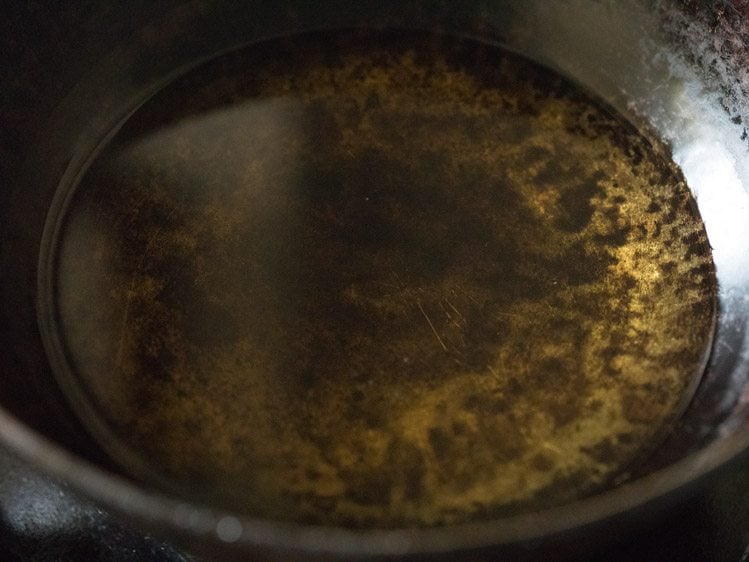 heating oil in a pan for frying cheese pakora. 