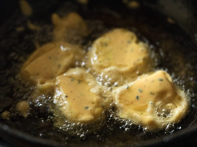 frying cheese pakoras in hot oil. 