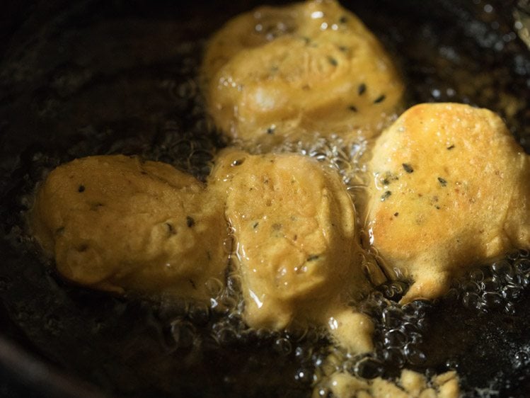 frying cheese pakoras in hot oil. 