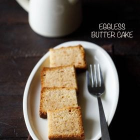 butter cake squares on oval white plate with a fork by side.