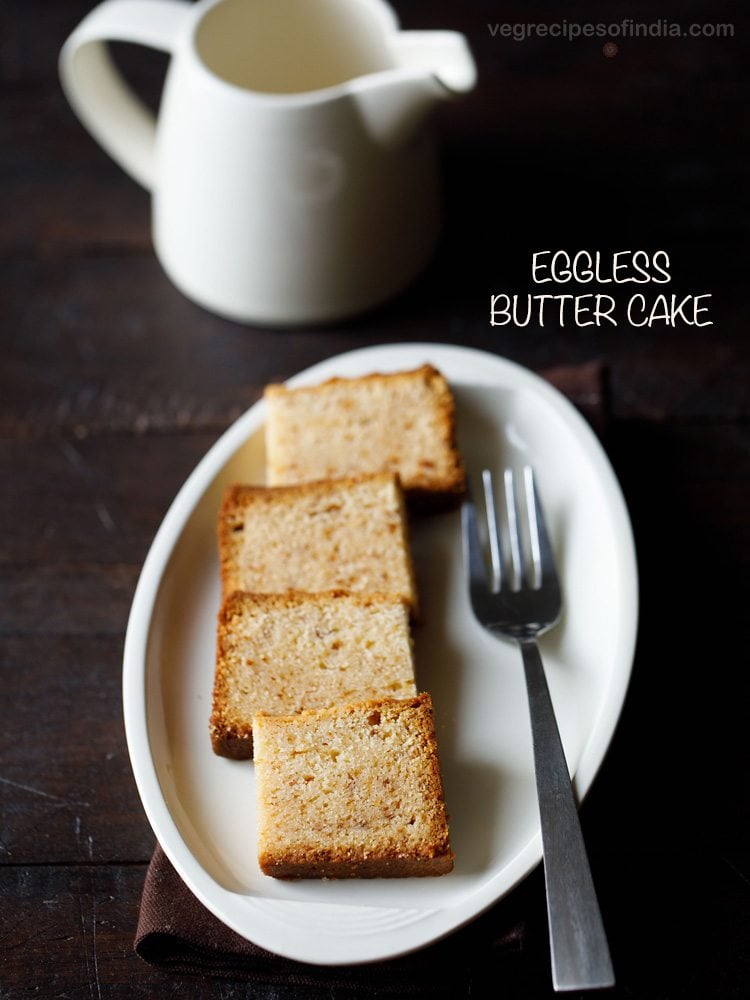 butter cake squares on oval white plate with a fork by side.