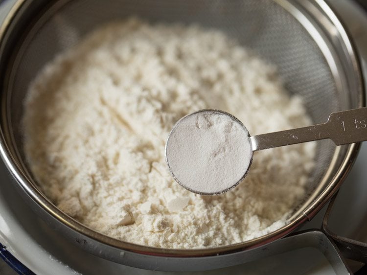 baking powder in a measuring spoon.