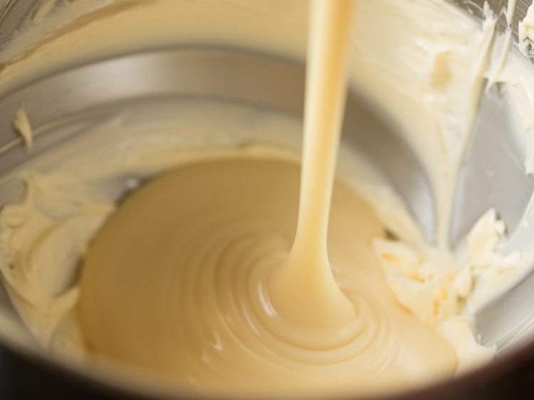 condensed milk being poured on butter.