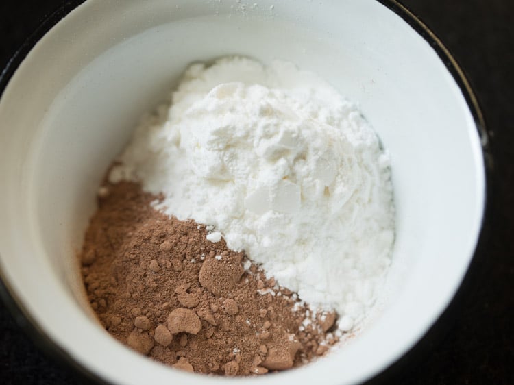 cocoa powder and cornstarch in a white mixing bowl