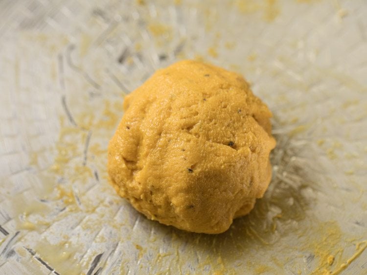 kneading dough till all the water is absorbed. 