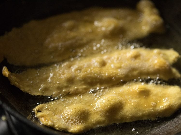 frying fafda pieces in hot oil. 