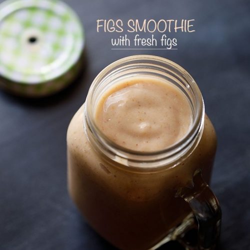 fig smoothie in a drinking glass jar with the lid on the side.