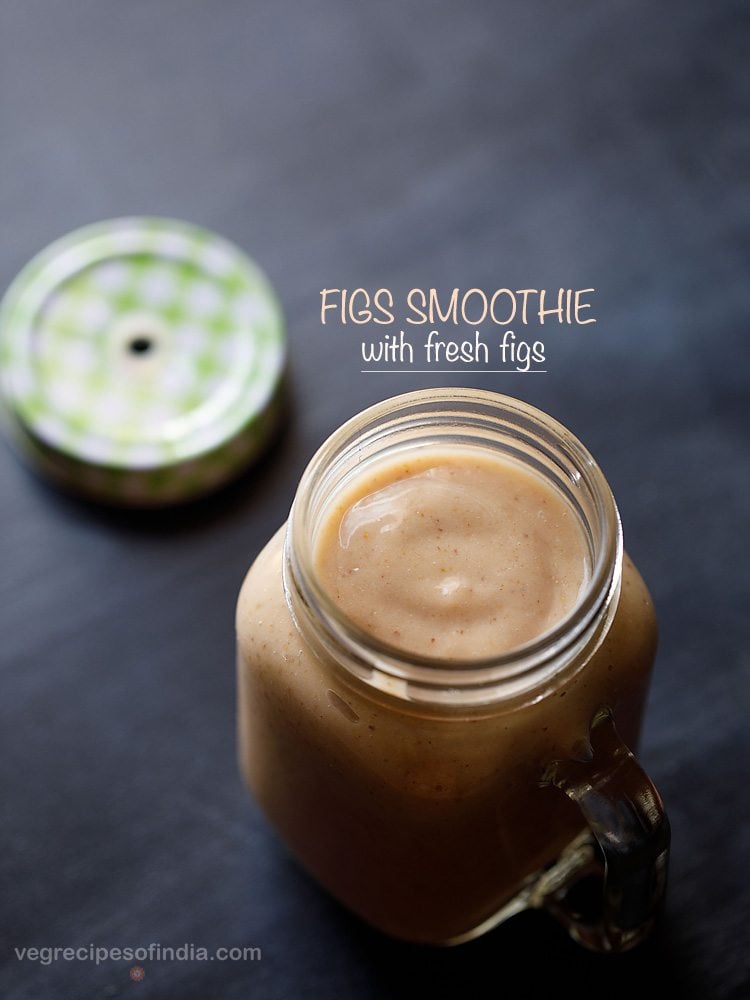 fig smoothie in a drinking glass jar with the lid on the side.