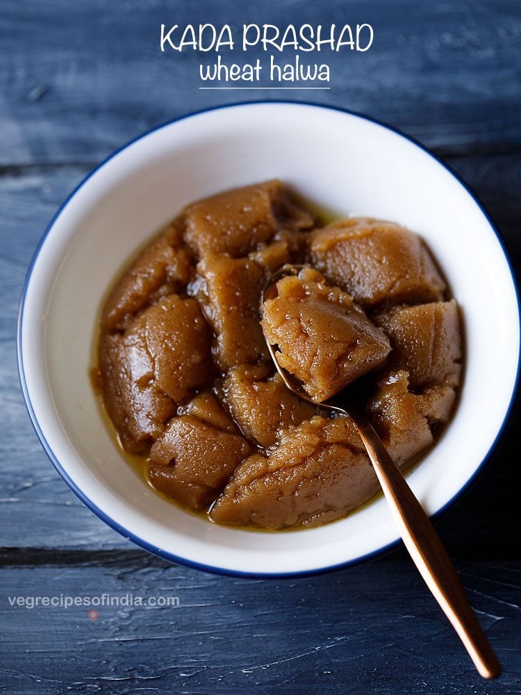 kada prasad served in a white bowl with a spoon in it and text layovers.