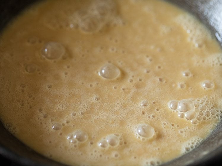 whole wheat flour-ghee mixture in pan. 