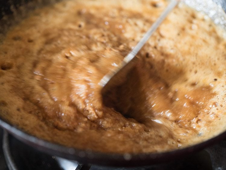 mixing sugar solution in the fried whole wheat flour. 