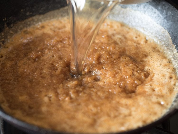 adding second part of hot bubbling sugar solution to the fried whole wheat flour. 