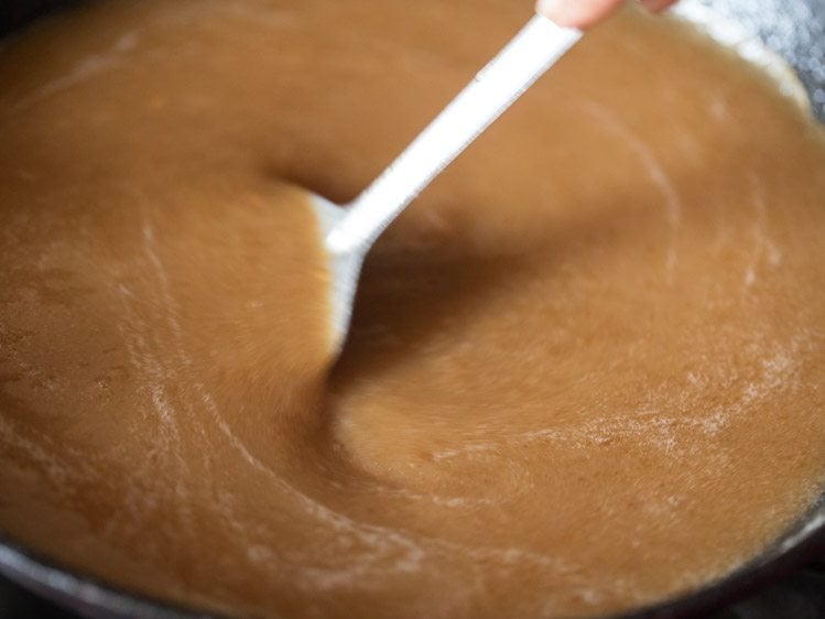 mixing sugar solution well in the fried whole wheat flour. 