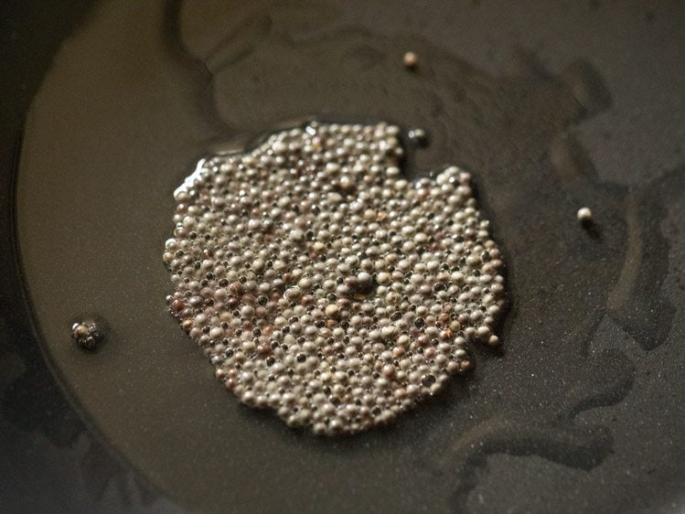 mustard seeds spluttering in hot oil. 