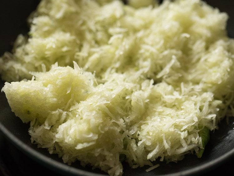 grated raw papaya added to the pan. 