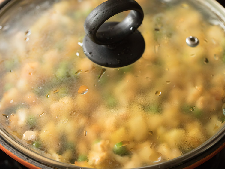 simmering vegetables in covered pan. 