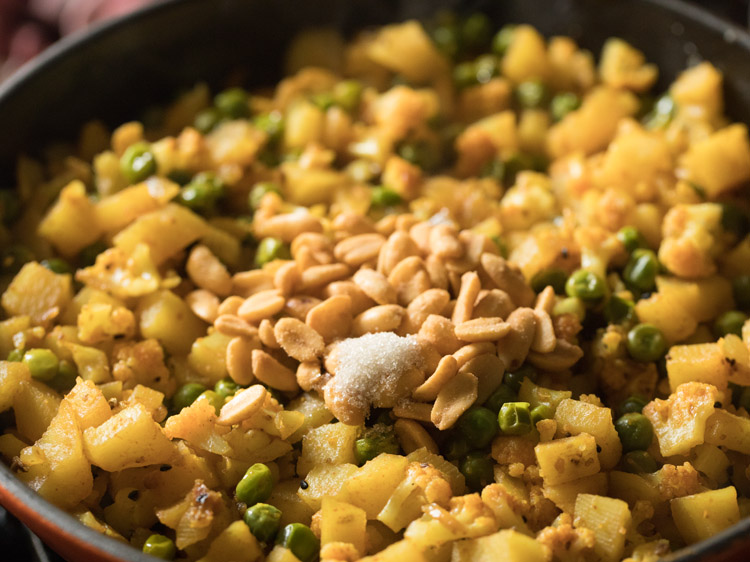 roasted peanuts and sugar added to the cooked vegetable mixture. 