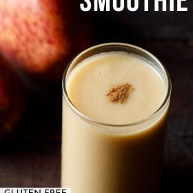 apple smoothie served in a glass garnished with cinnamon powder with two apples kept on the side with text layovers
