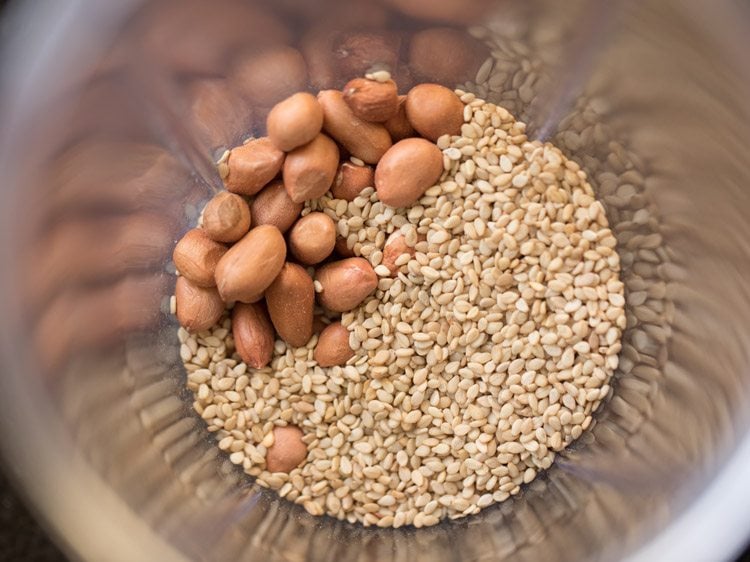 Peanuts and sesame seeds in jar.