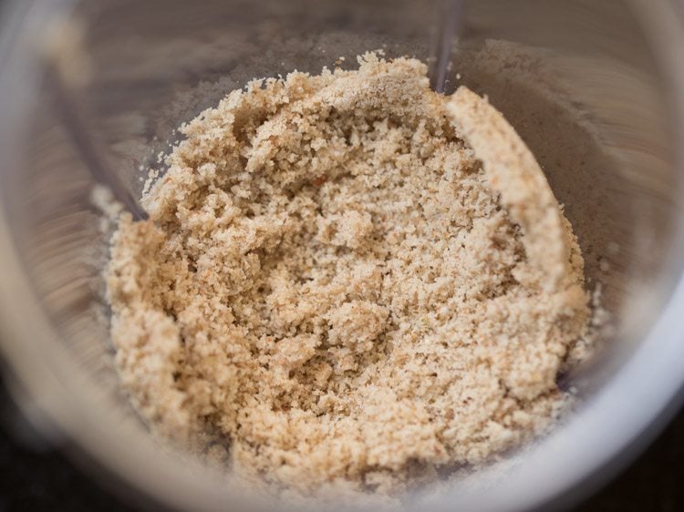 Ground coconut and seed mixture in jar.