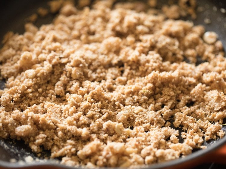 Close up shot of brinjal curry base in skillet.