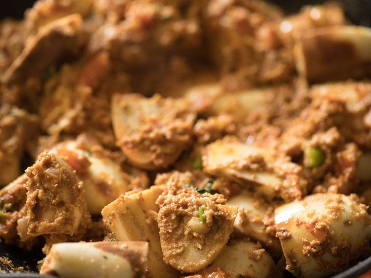 Eggplant curry mixture in skillet.