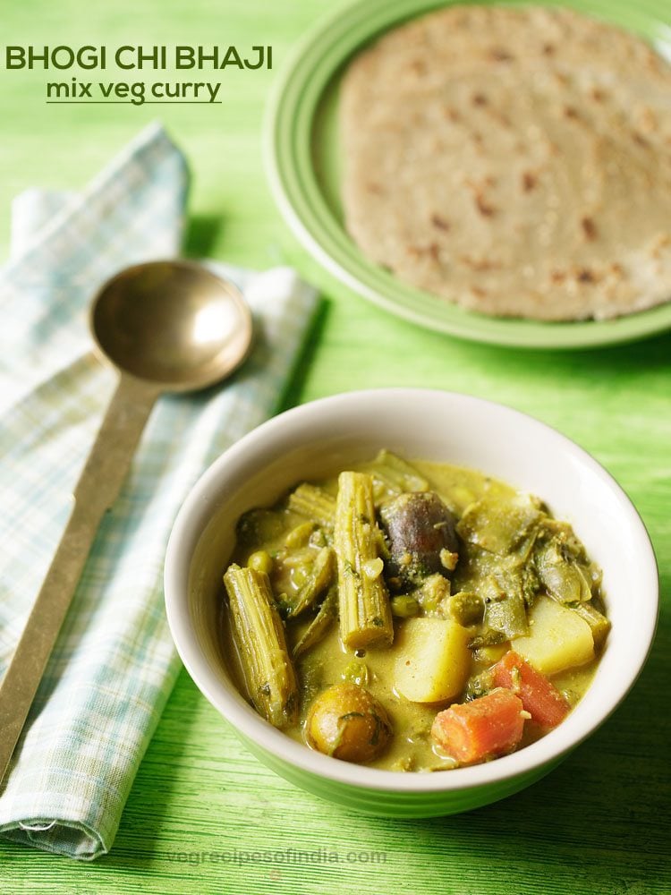 bhogichi bhaji served in a green colored ceramic bowl with a spoon kept on the left side and a plate of bhakri kept in the top right side and text layovers.