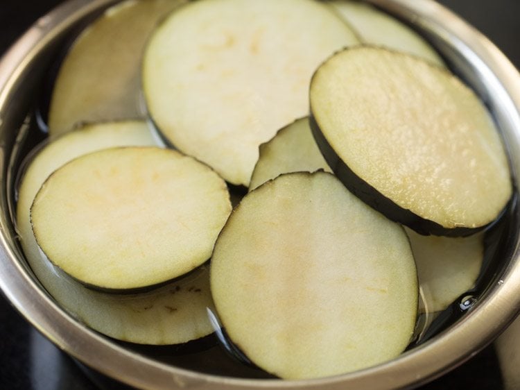 soaking brinjal slices in water. 