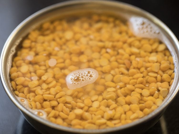 chana dal soaking in water for making kadalai paruppu sundal.  