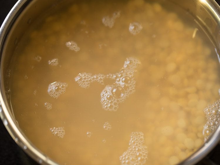 water added to chana dal in pan for making kadalai paruppu sundal.