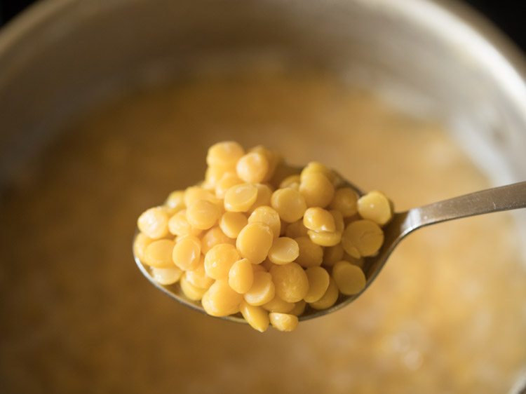 well cooked chana dal in a spoon. 