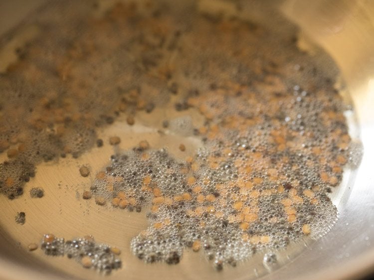 frying till mustard seeds crackle and urad dal turns golden. 