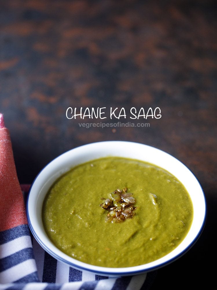 chane ka saag served in a blue rimmed white bowl with text layovers.