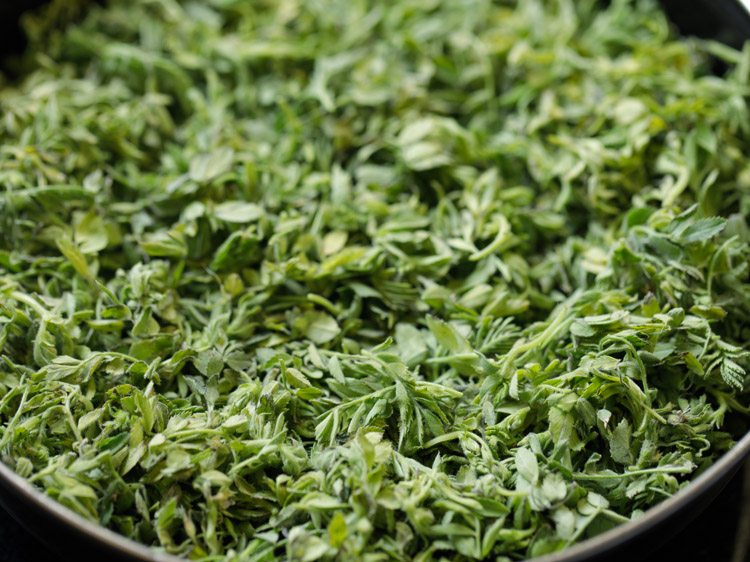 chana saag added in a bowl. 