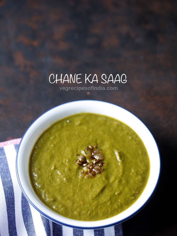 chane ka saag served in a blue rimmed white bowl with text layovers. 