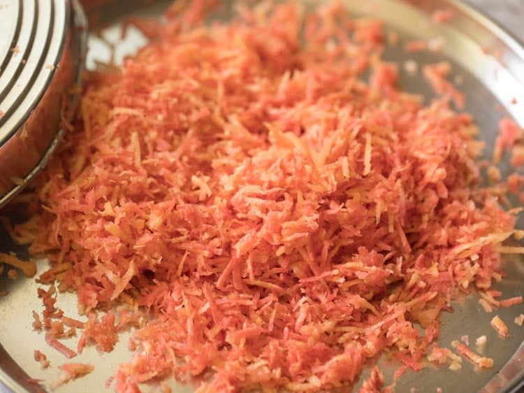 grated carrots in a steel plate