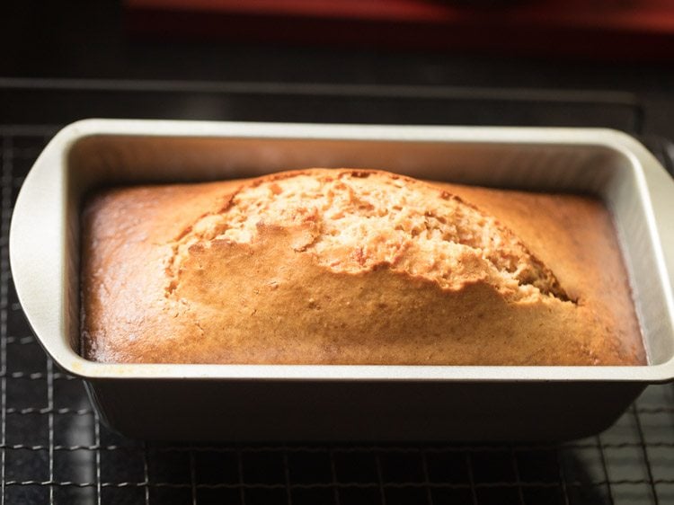 eggless carrot cake baked in the pan and placed on wired rack