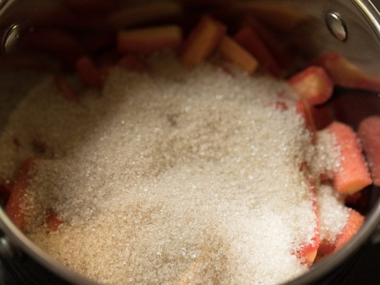 sugar added to carrots in pan. 