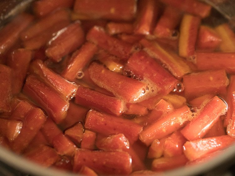 cooking carrots in the mixture. 