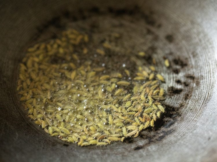 fennel seeds spluttering in hot oil. 