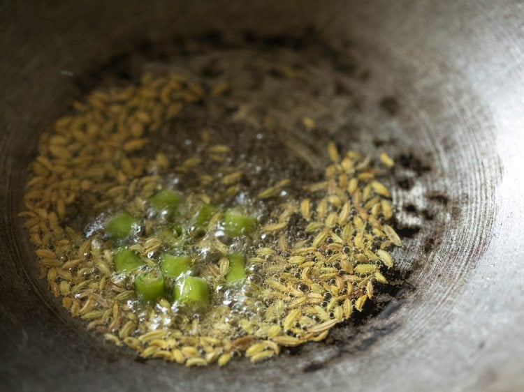 chopped green chilies added to the pan. 