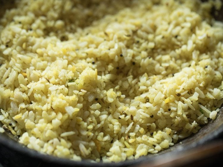 poha mixed gently with the tempering. 