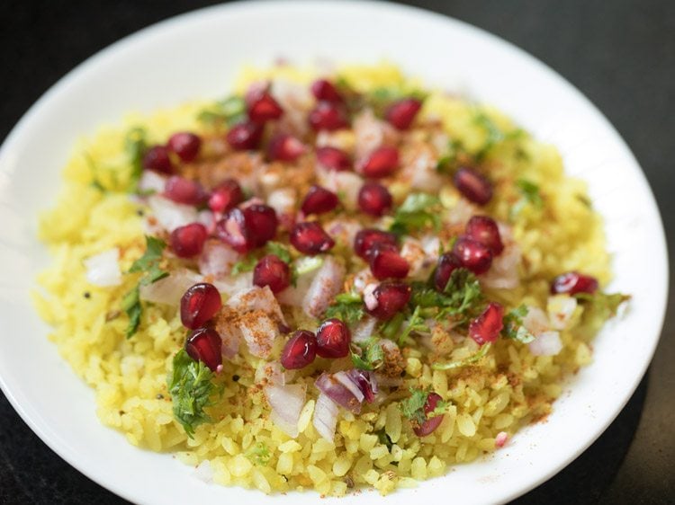 pomegranate arils added on poha. 