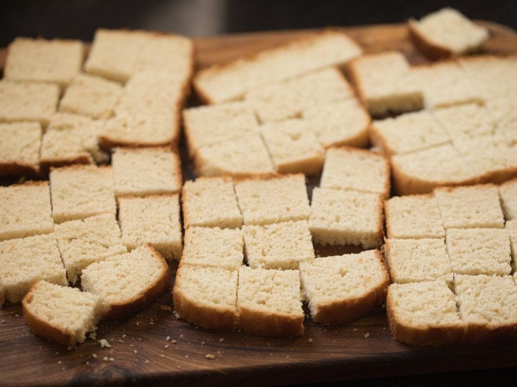 bread cut into small cubes for making bread masala. 
