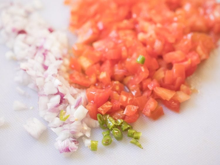 finely chopped onion, tomato and green chili for making bread masala. 