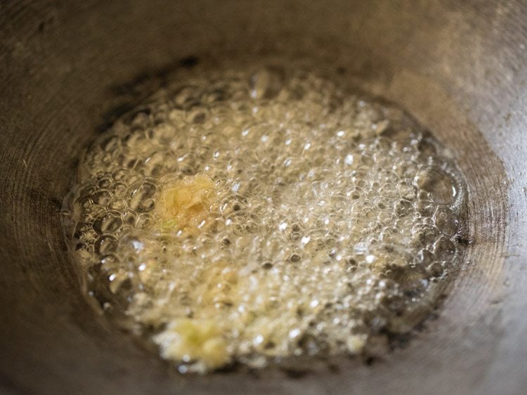 ginger garlic paste added to hot oil in pan. 