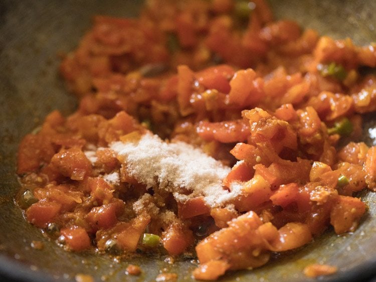 salt added to onion-tomato masala. 