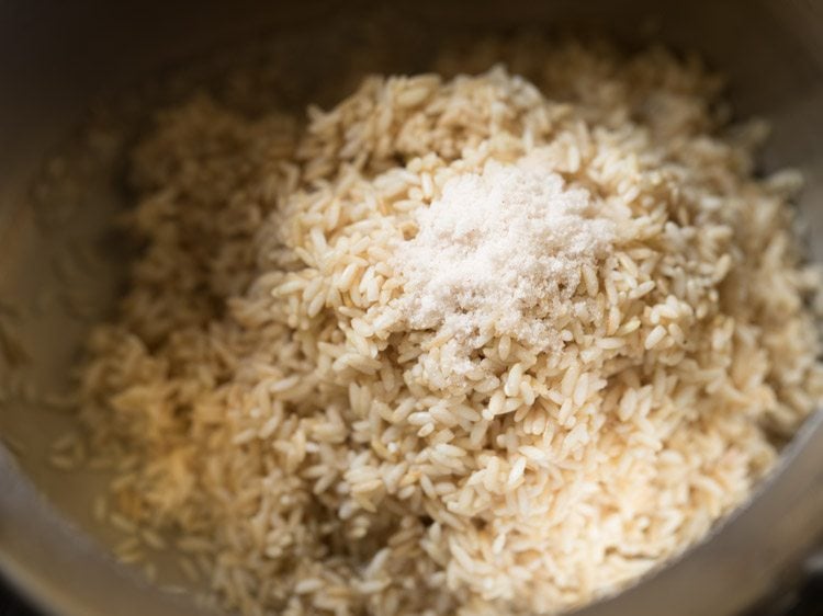 drained rice and salt added to a pressure cooker.
