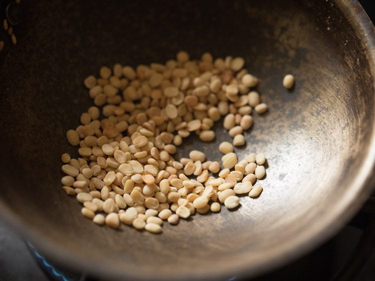 roasting urad dal till light golden.