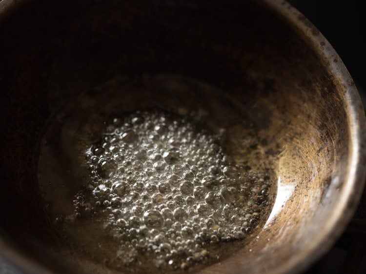 mustard seeds crackling in the hot sesame oil.